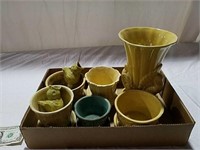 Yellow vase and planters