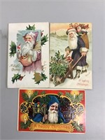 Lot of three early Santa Claus postcards.