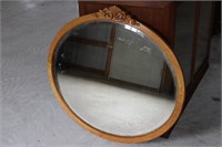 Large round oak framed mirror with detailed