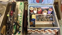 Sewing basket with thread, scissors, grass