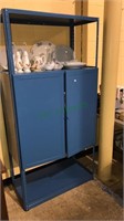 Blue metal storage cabinet with three shelves,