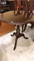 Cherry pedestal side table, 25 x 24“ in