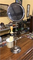Antique shaving mirror with the shaving cup in