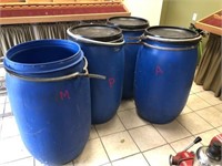 4 blue storage barrels