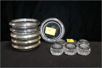 6 STERLING RIMMED COASTERS AND 6 CRYSTAL SALTS