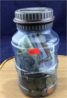 Jar of Foreign Coins and Currency