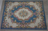 4ft 7in by 6ft 6in Pale Blue Pink Weaved Area Rug