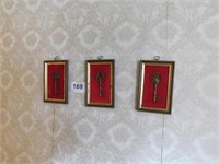Three framed keys on red background