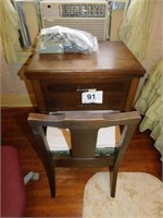 Sears Kenmore sewing machine in wooden cabinet,