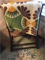 Antique quilt with quilt stand