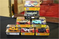 Seven Auto World slot racers including '69 AMC