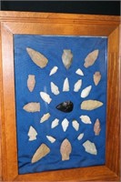 Assortment of 27 arrow heads framed. Noted on