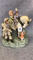 Porcelain figurine of children riding a horse