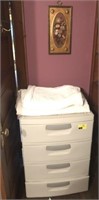 Sterilite dresser with blankets and picture