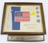 FRAMED AMERICAN FLAG THAT WAS CARRIED ABOARD