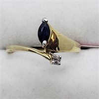 $750. 10kt. Diamond and Sapphire Ring