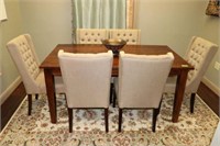 Table with 6 Chairs, bowl, and rug.