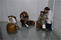3 Oriental mud men statues