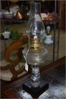 Bust supported oil lamp