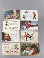 A lot of eight Santa Christmas postcards.