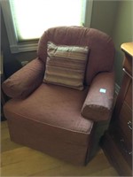 Nice upholstered arm chair with cushion.