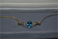 14 kt gold Blue topaz and Diamond Bracelet 7"