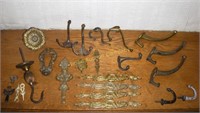 Lot of brass wall hooks, escutcheons, etc.