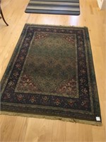 Persian rug, 6’ x 4’. 
Small burn at one end.