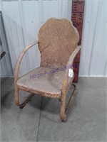 Antique metal lawn chair. Yellow in color