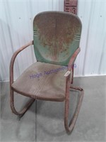 Antique metal lawn chair. Green in color