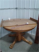 Round oak table, 48", with 24" leaf