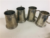set of 4 pewter mugs(dented)