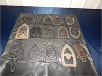 15 Iron trivets (cast iron) w/maker marks