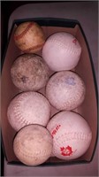 Box of 5 softballs and 2 baseballs