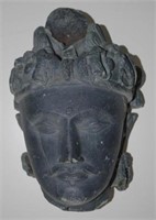 Asian carved stone head