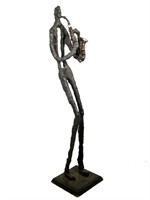 Brutalist Cast Metal Man with Saxophone Sculpture