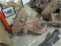 Group of Model A parts: 2 transmissions, fender,