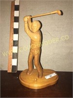 Handcarved wooden golfer