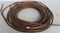 Partial roll of 1/4" copper tubing.