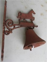 Cast iron bell with horse top.