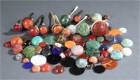 Assorted snuff bottle stoppers & cabochons.