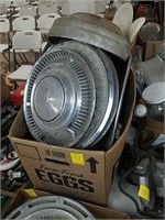Big box of vintage hubcaps