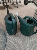 2 plastic watering cans