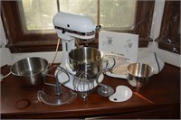 Kitchen Aid mixer with attachments, bowls, etc.