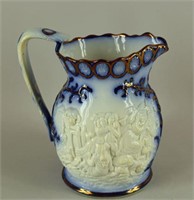 Heavily Embossed Flow Blue Pitcher