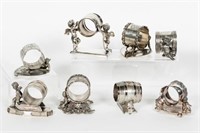 Eight Silverplate Figural Cherub Napkin Rings