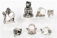 Seven Silverplate Figural Cherub Napkin Rings