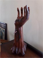 WOODEN CARVED ARM W/STAKE THROUGH IT