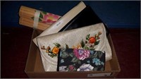 Box of clutches and hand painted bamboo placemats