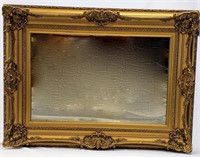 A LARGE GILDED MIRROR